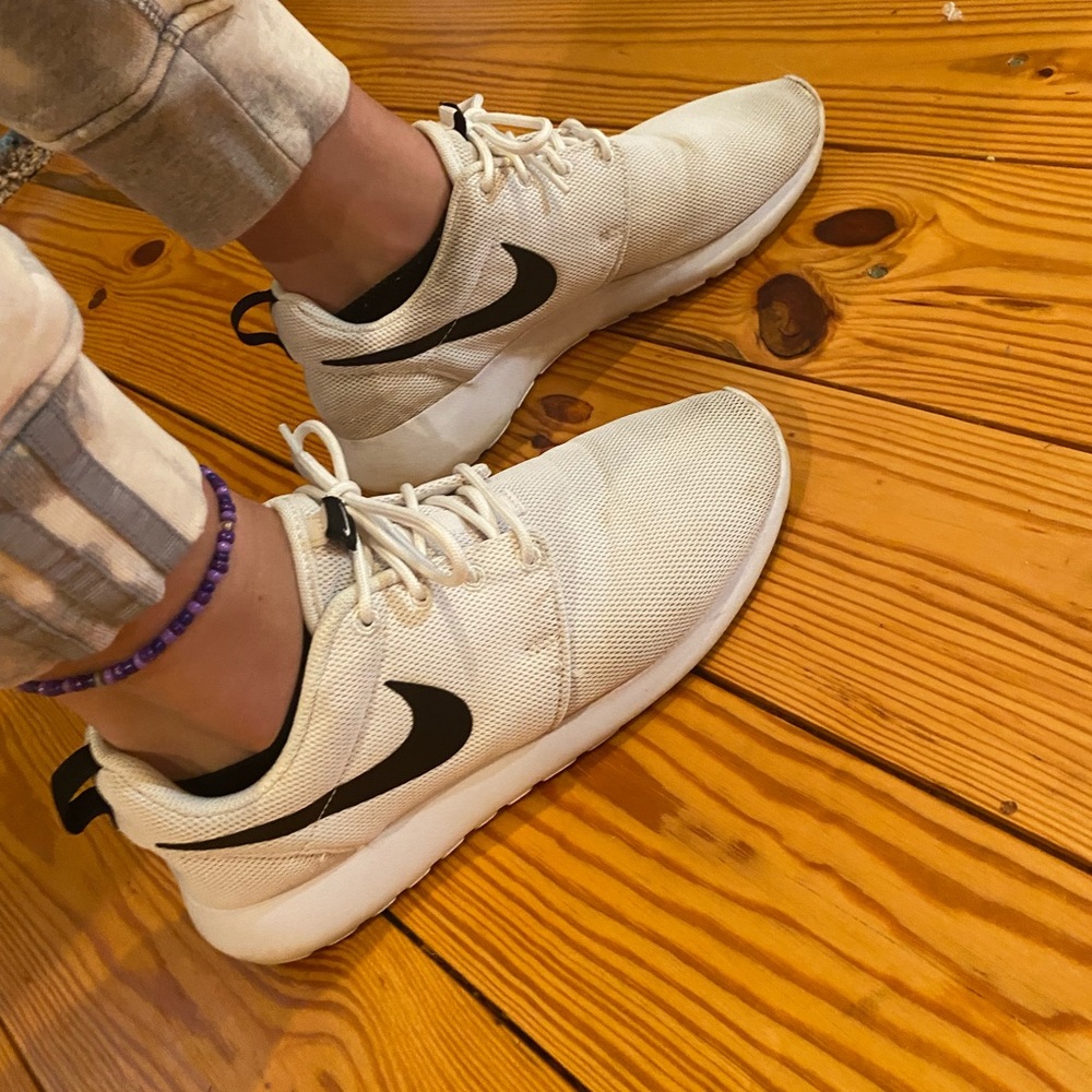 White and black nike shoes